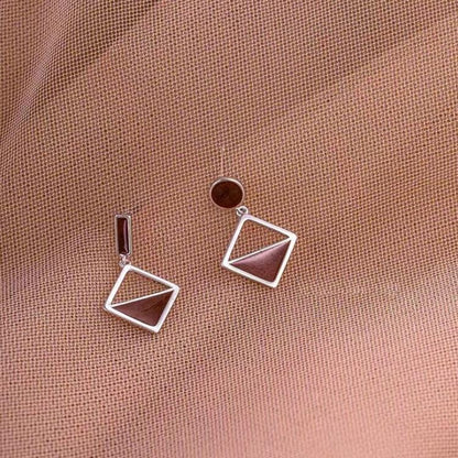 925 Silver Asymmetrical Earrings: Brown Love Knot Design